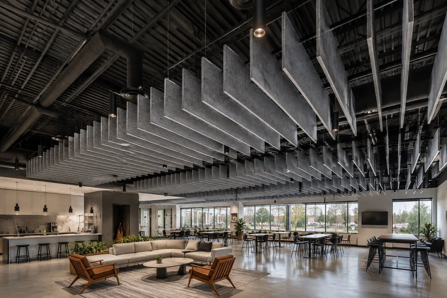 Finished commercial lounge with suspended acoustic ceiling baffles