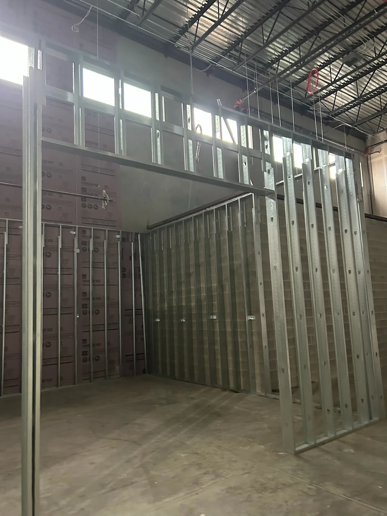 Steel stud partitions with framed commercial openings