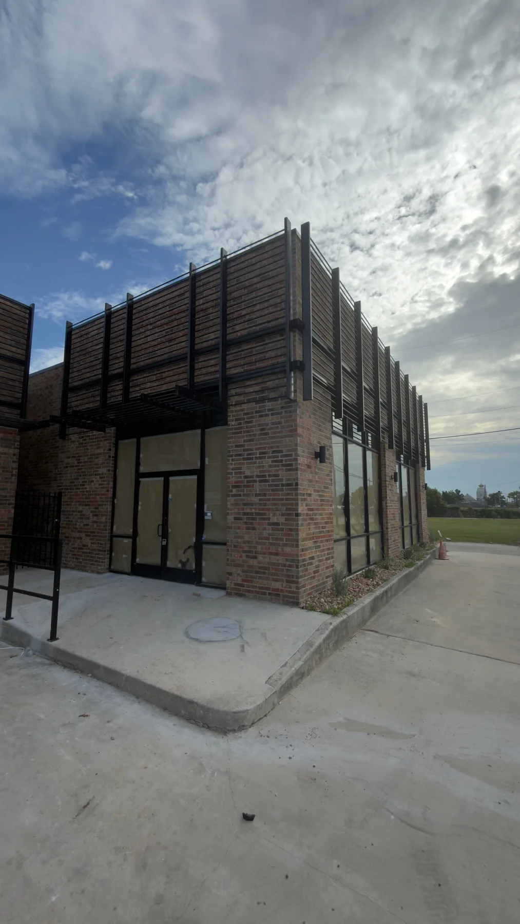 Commercial storefront exterior with installed entry doors and frames